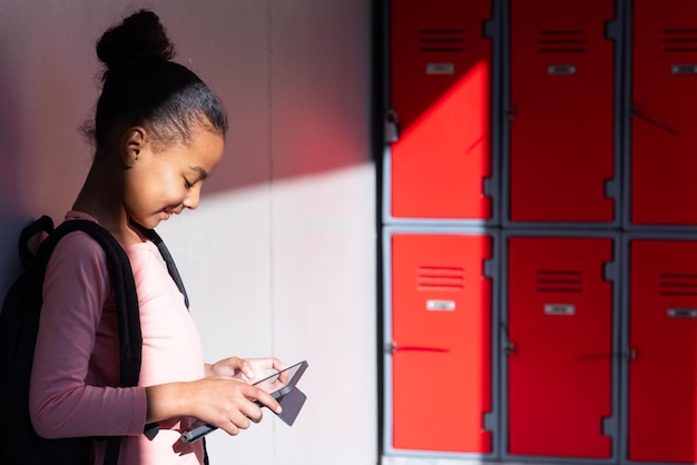 A student registering for emergency alerts on their phone, illustrating the importance of staying informed about campus safety.