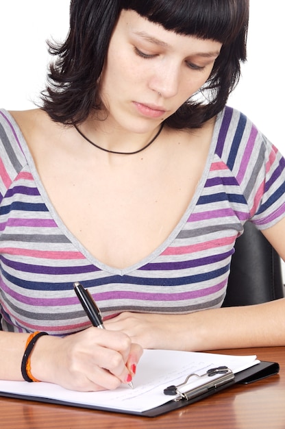 A close-up of a student-athlete carefully reviewing a document outlining NCAA guidelines, with a pen in hand and a focused expression. The lighting emphasizes the seriousness and importance of understanding these regulations.