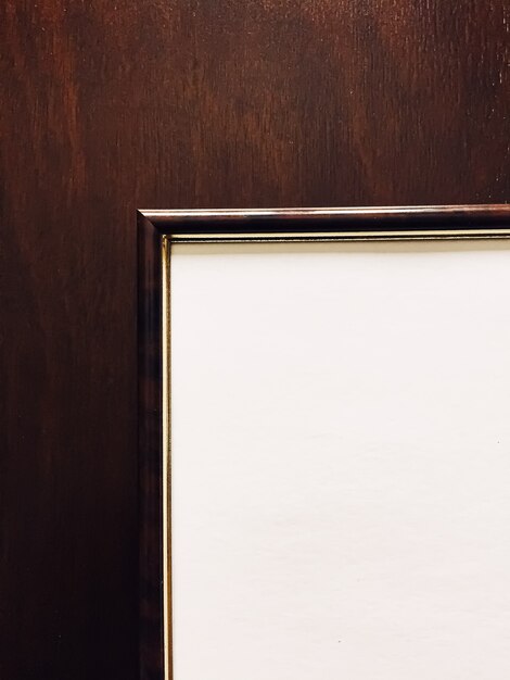 A close-up shot of an official accreditation certificate hanging on a wall in a university hallway. The certificate is framed and prominently displays the name of the accrediting agency.