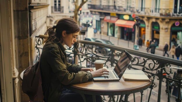 A student sitting at a cafe in Paris, using a laptop to research affordable housing options, showcasing proactive planning and cost-consciousness.