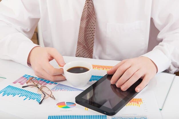A person analyzing financial data charts on a tablet, with coffee and calculator alongside, illustrating data-driven financial planning.