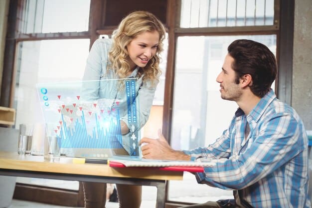 A couple analyzing investment charts and graphs on a computer screen, discussing their financial strategy with confidence.