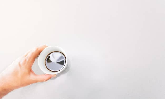A close-up shot of a thermostat being adjusted, symbolizing energy conservation efforts within a home.