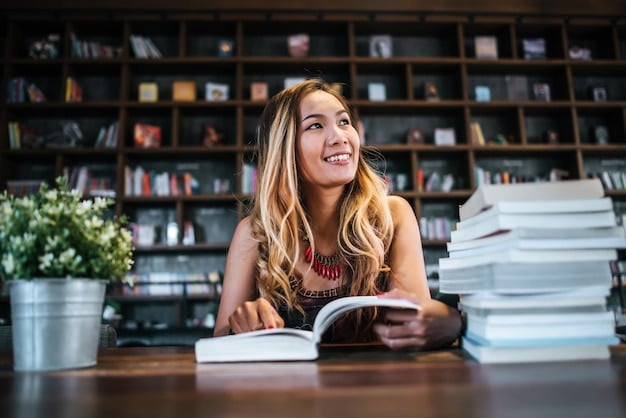 A wide shot of a US student sitting in a library in a foreign country, surrounded by books in a different language. The student is smiling and appears engaged in studying.