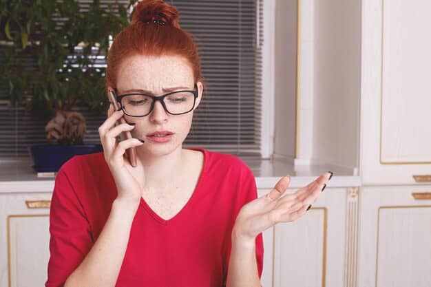 A person receiving a suspicious phone call with a concerned expression, emphasizing the need to verify the caller's identity before sharing any information.