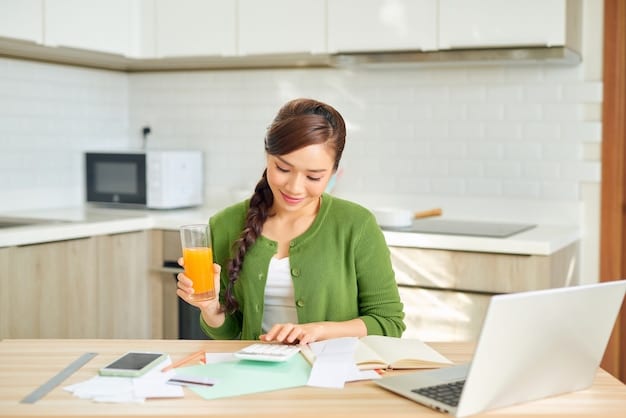 A person sitting at a desk with a laptop showing a budgeting spreadsheet, surrounded by neatly organized bills and a cup of tea, illustrating mindful expense tracking.