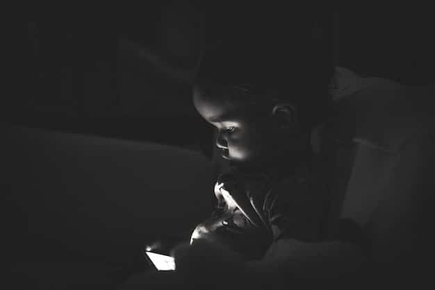 A silhouette of a student sitting alone in a dark room, illuminated by the glow of a smartphone, conveying feelings of isolation, loneliness, and the invisible burden of cyberbullying.