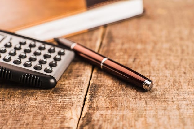 A close-up of a calculator with tax forms and a pen, symbolizing the calculation and filing process for the Earned Income Tax Credit.