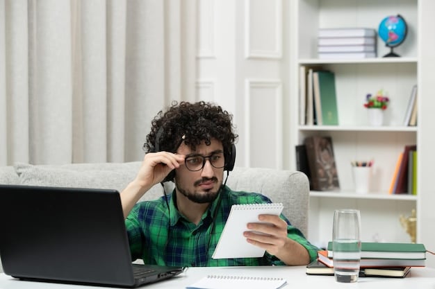 A person sitting at a desk, looking concerned while reviewing student loan documents on a laptop. The scene captures the anxiety and complexity of managing student loan debt.