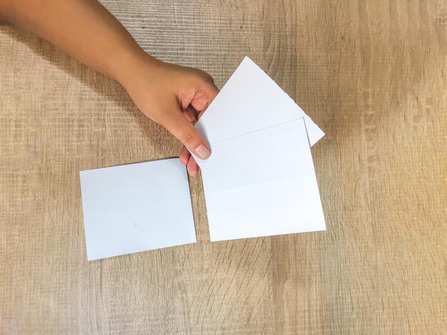 A close-up shot of a Housing Choice Voucher (Section 8) being handed from a housing authority representative to a young adult. The voucher is a symbolic representation of access to affordable housing. The setting is a bright, modern office.