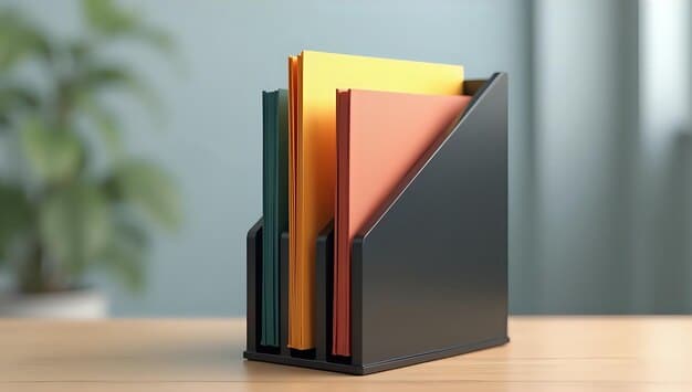 A person organizing documents in a file folder, labeled